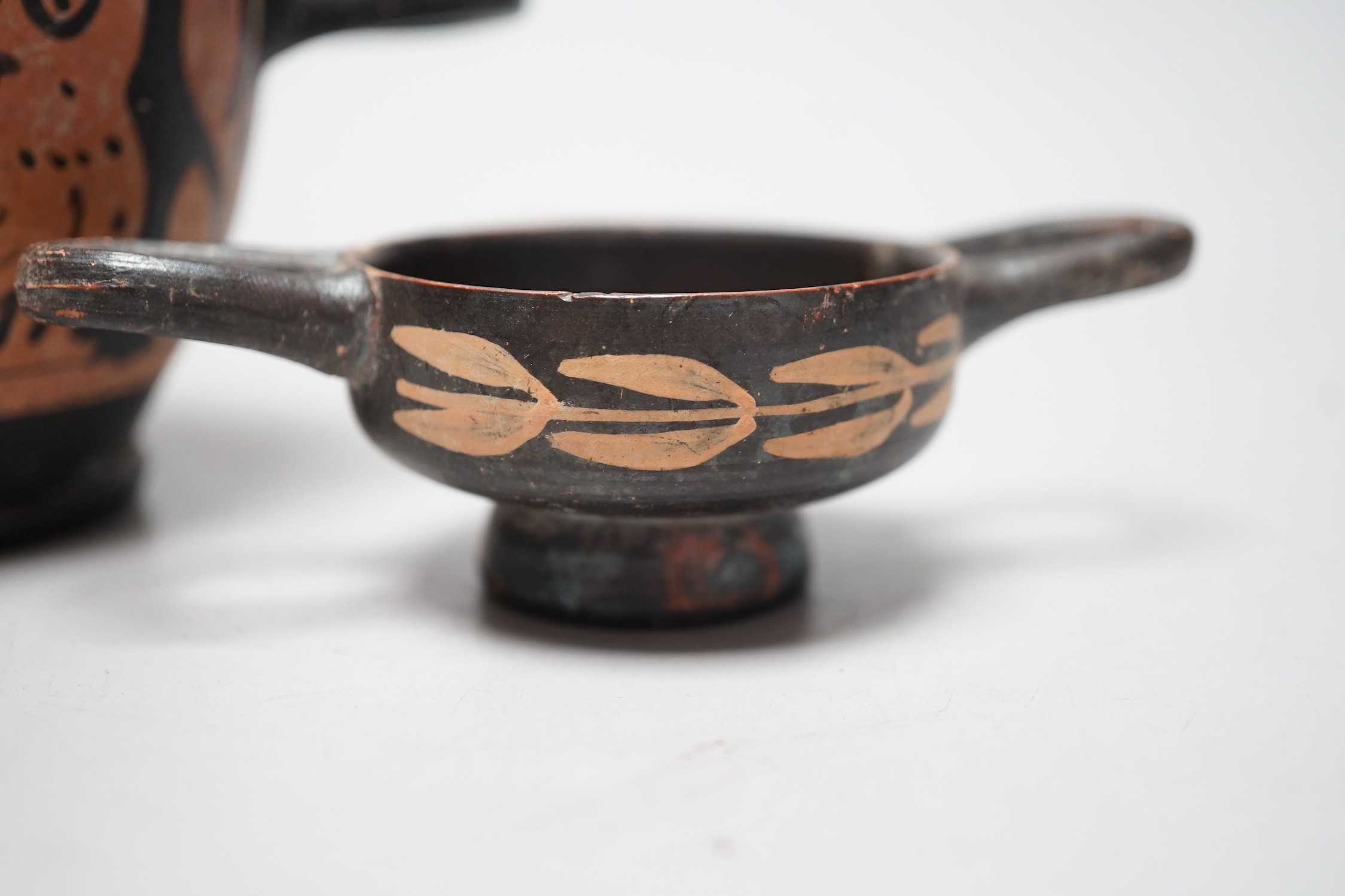 A 4th century B.C. South Italian Greek red figure bowl skyphos, together with another similar smaller vessel. Larger 14.5cm handle to handle